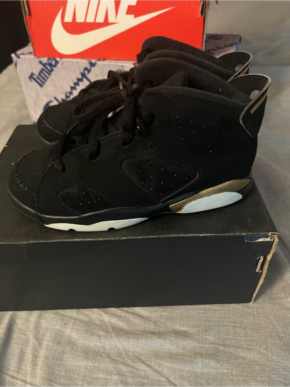 Jordan Kids Black High-Top Sneakers with Gold Accent